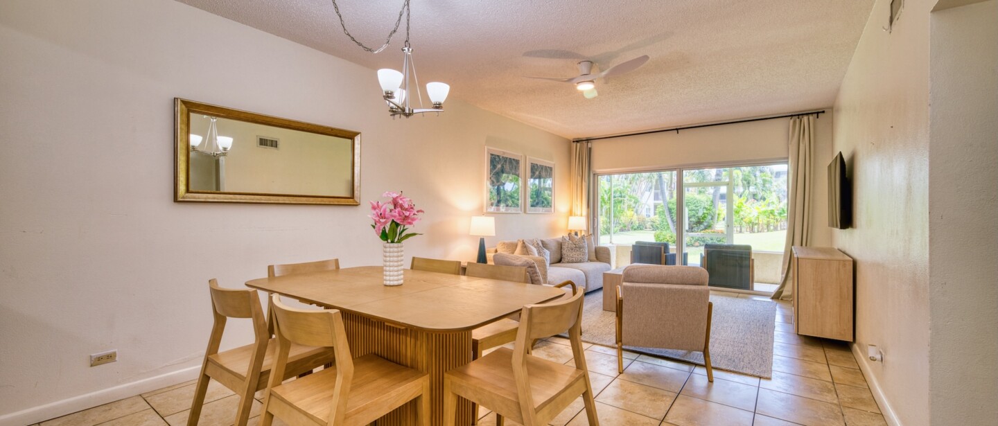 Bright open living-dining space with patio access and garden views