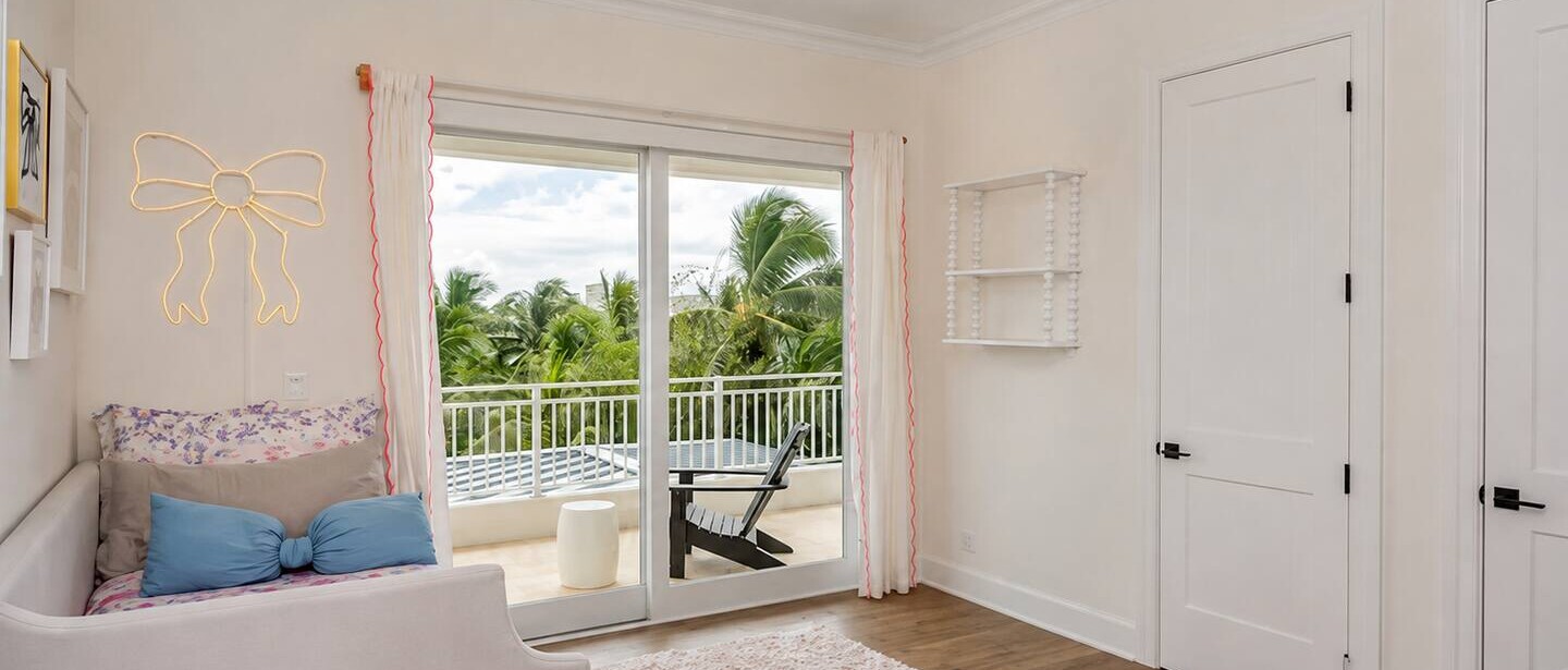 The single bedroom features its own bathroom and private balcony.