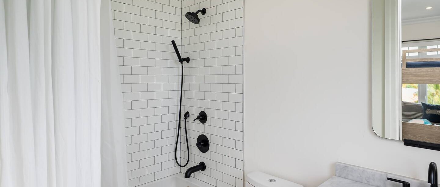 A bathroom with a shower and bath.