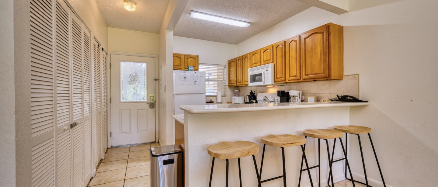 Bright kitchen with breakfast bar seating for four