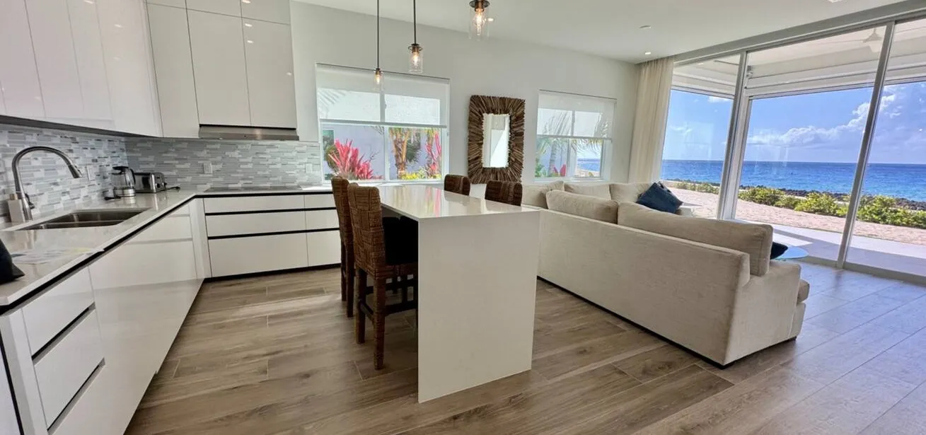 The inside dining table is higher, so you can eat inside with uninterrupted ocean views.