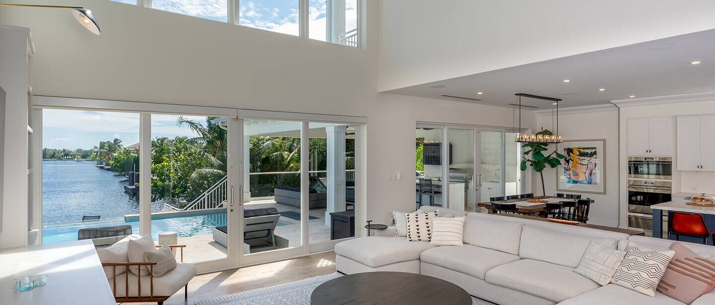 The living room, adjoined to a dining area.